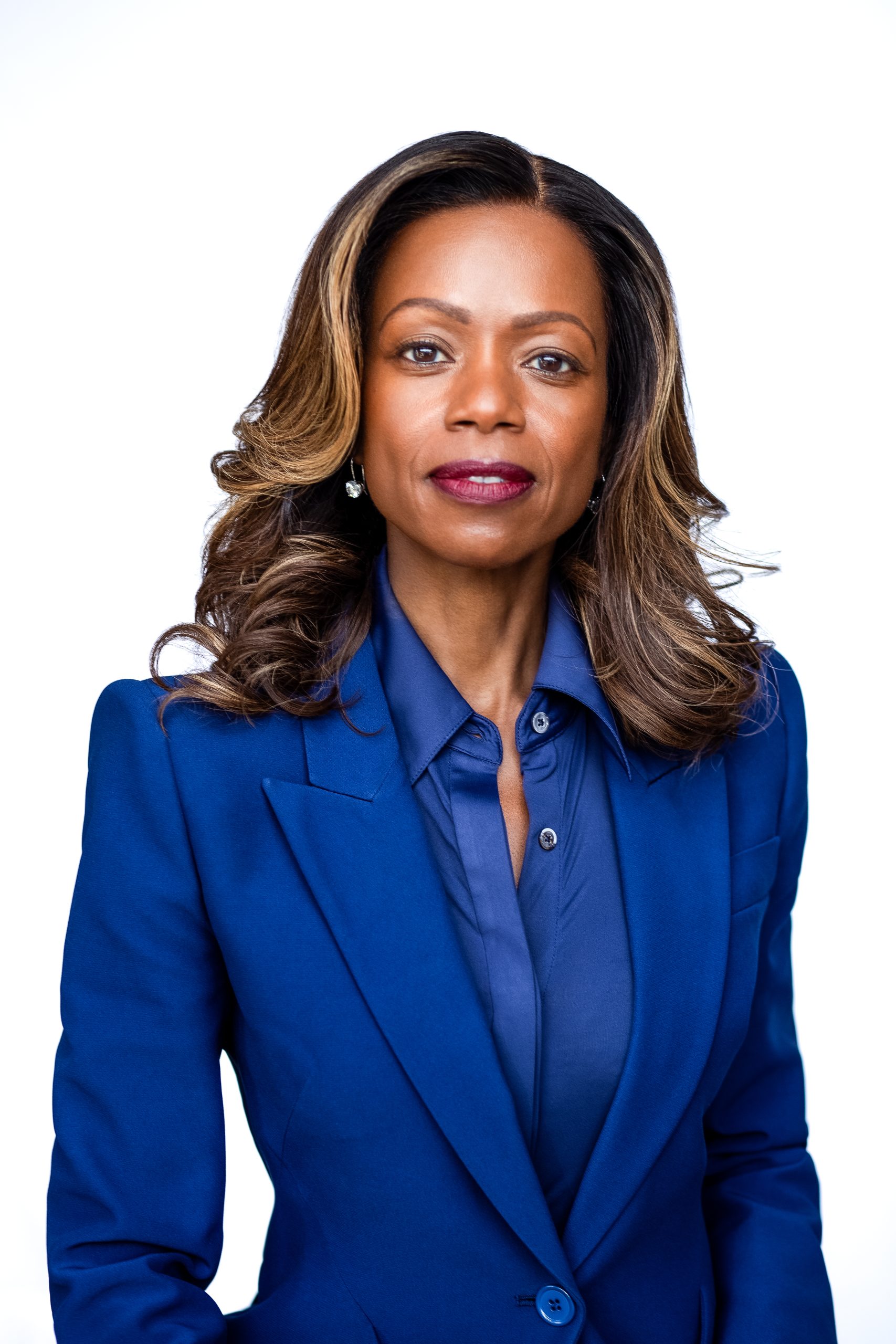 Dominque Purple Suit Head Shot Cropped